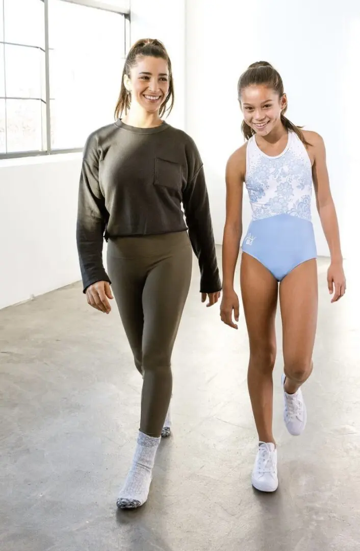 Two teen models wearing fit clothing