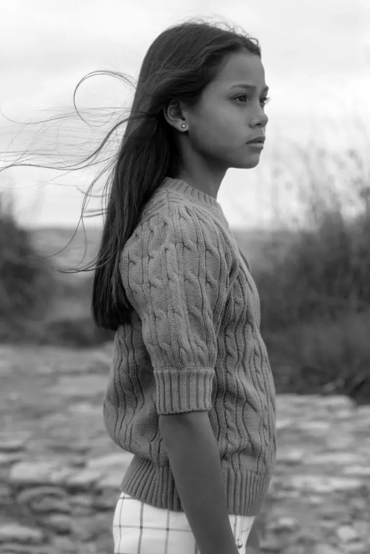 Black and white image of a girl with flying hairs