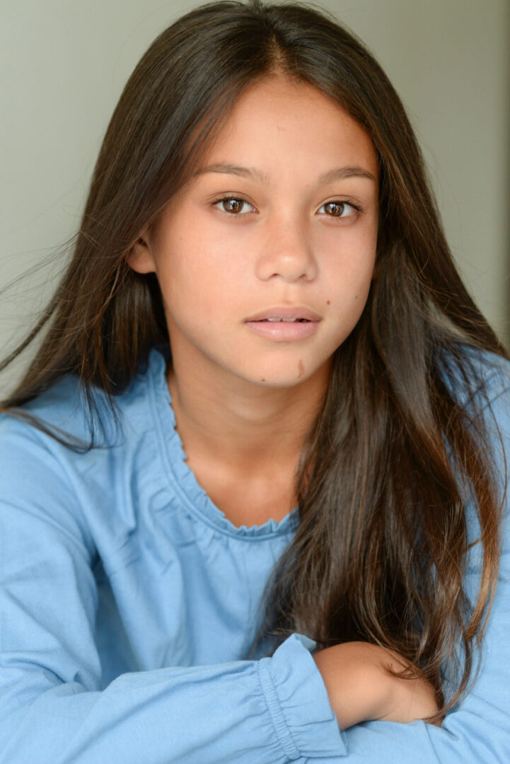 Caroline Quinn looking in front and wearing blue top