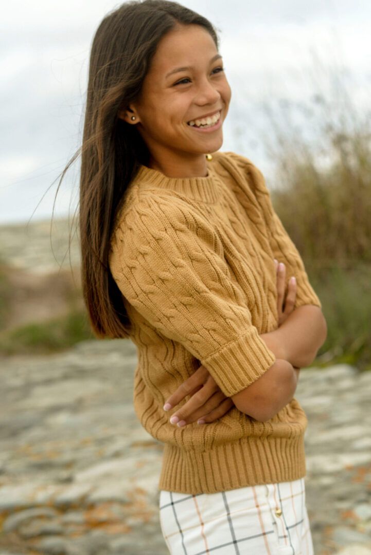 Caroline Quinn standing and smiling