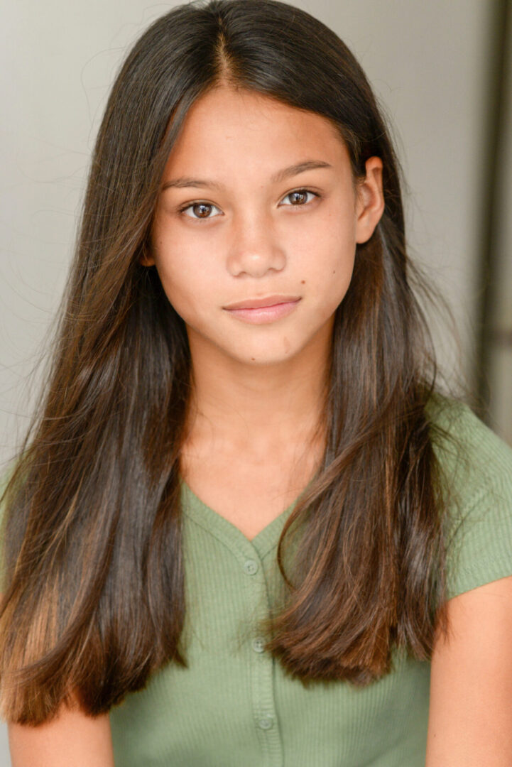 Caroline Quinn wearing green top