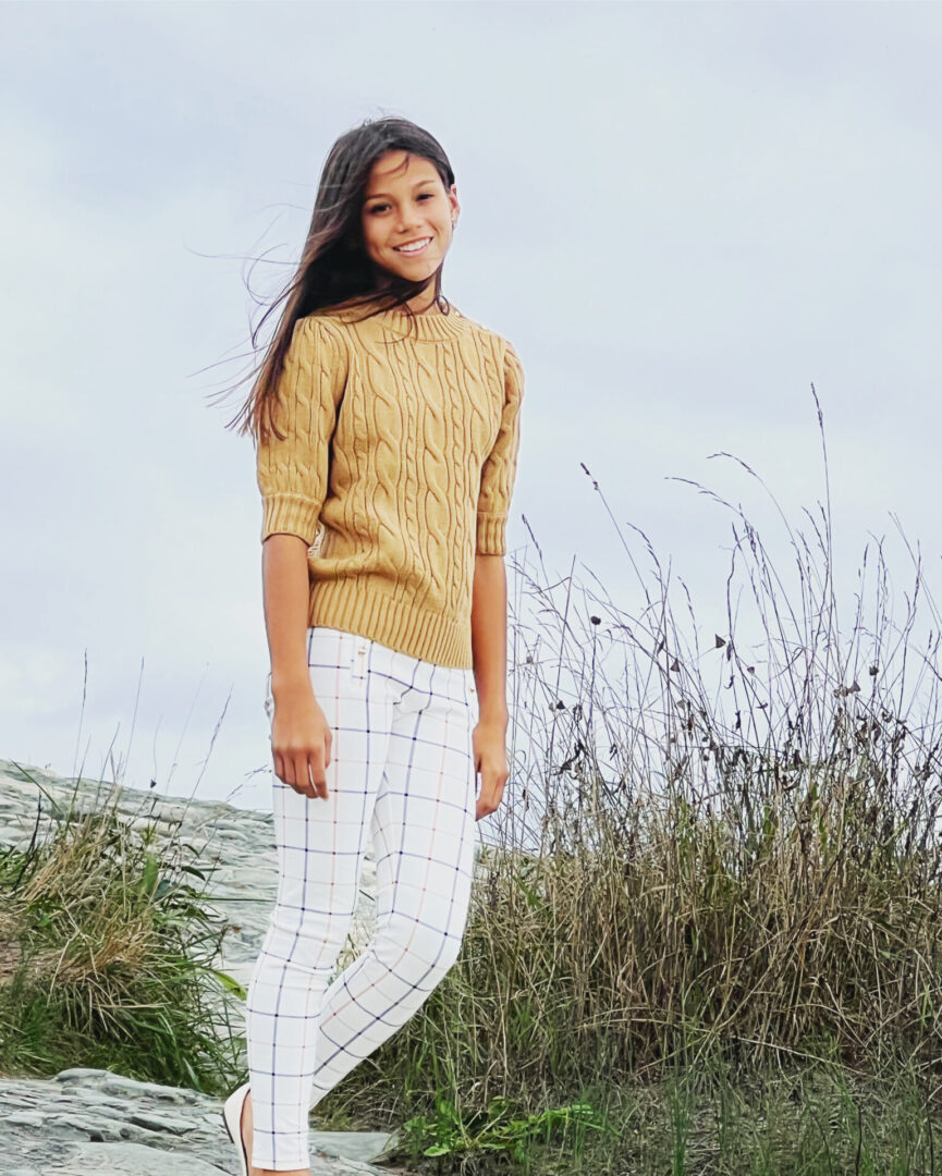 Caroline Quinn standing near a sea shore